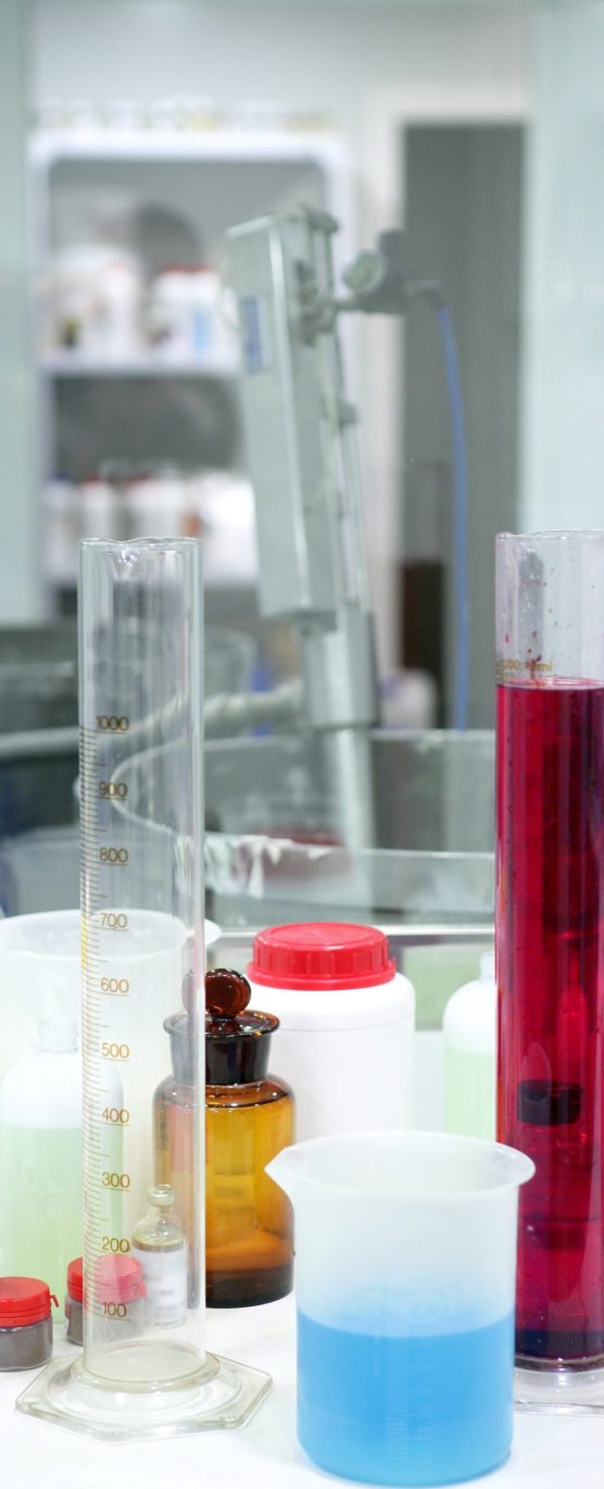 Laboratory stuff, glass cylinder vases, colorful liquids, chemical research
